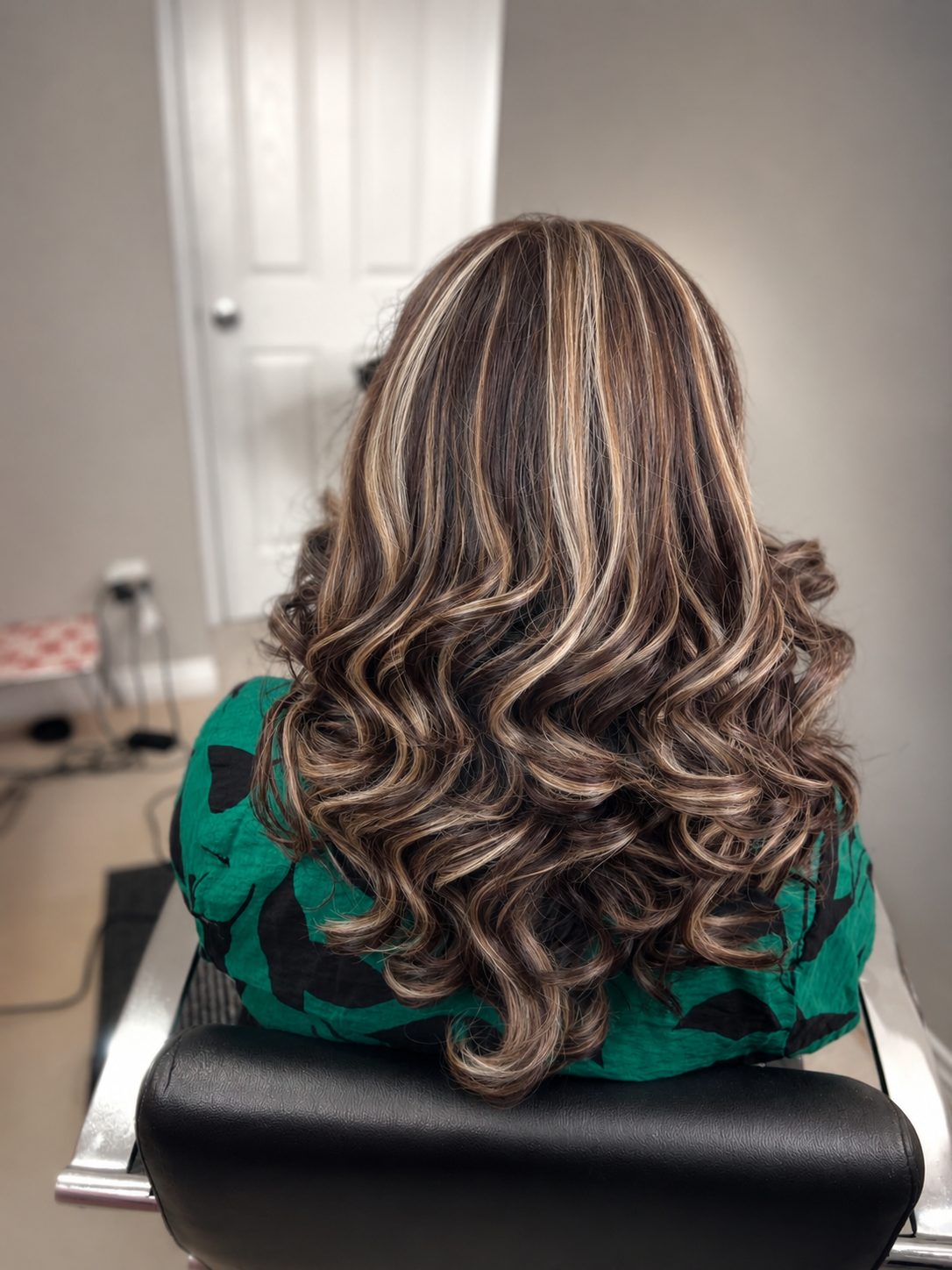 Chunky blonde highlights with bouncy ringlet curls