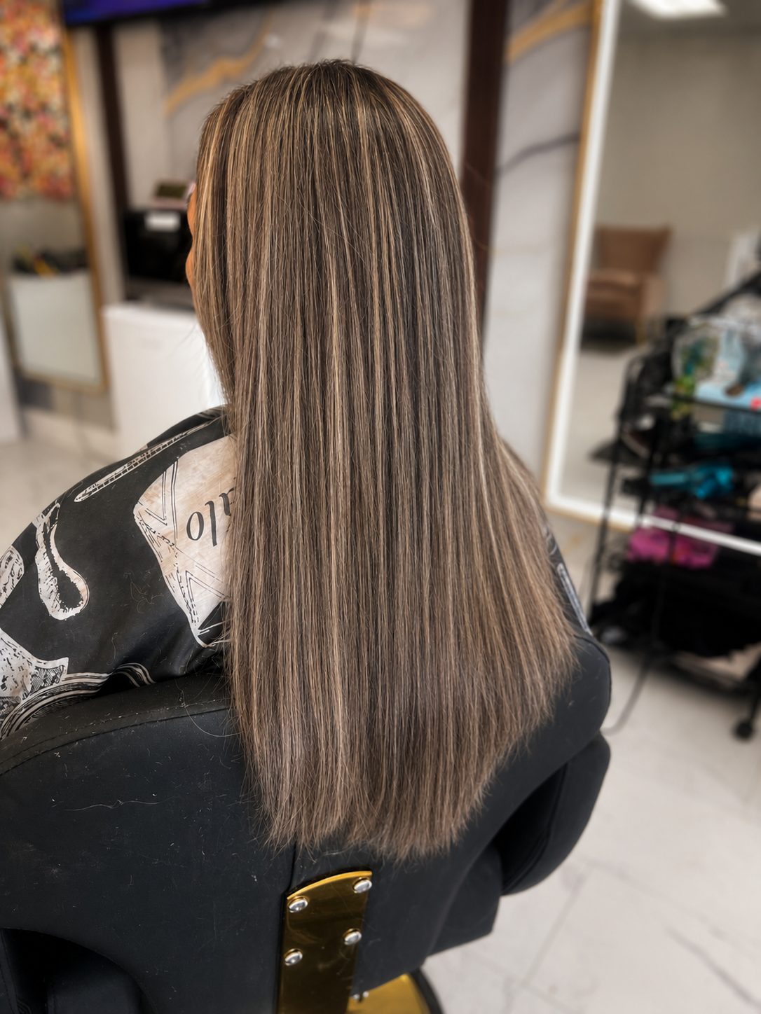 Cool ash bronde highlights, glass-straight finish