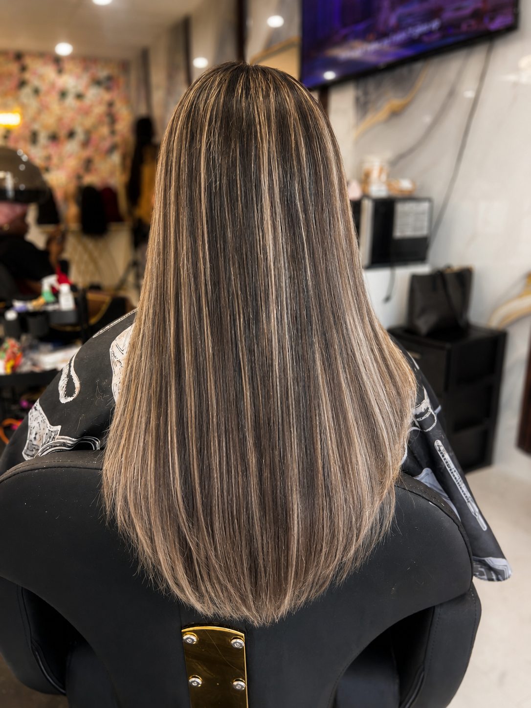Creamy blonde ribbon highlights with a soft U cut, back view