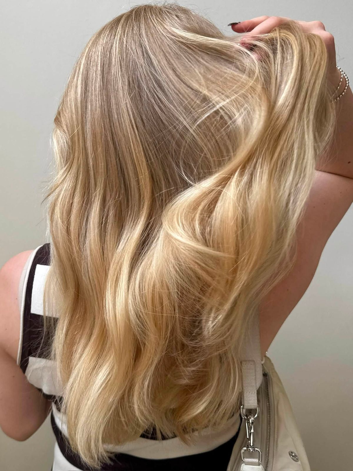 Ash blonde highlights, sleek straight side profile